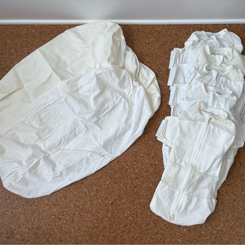 Bundle of Snoo sleep sacks and sheets